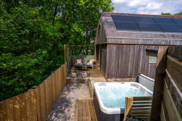 Mint Lodge private hot tub at dusk, Carmarthenshire